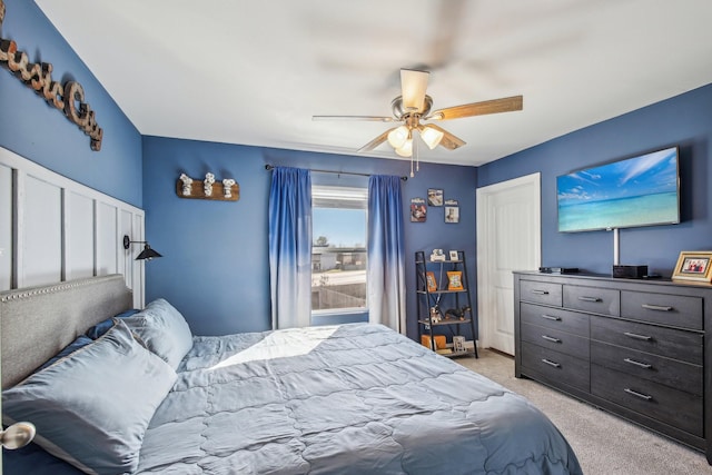 bedroom with light colored carpet and ceiling fan