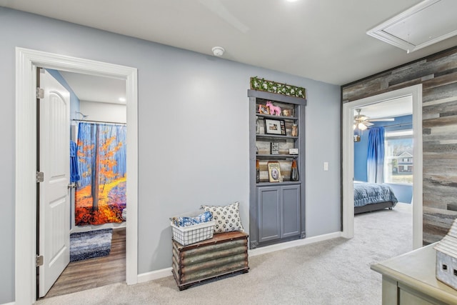 hallway featuring light colored carpet