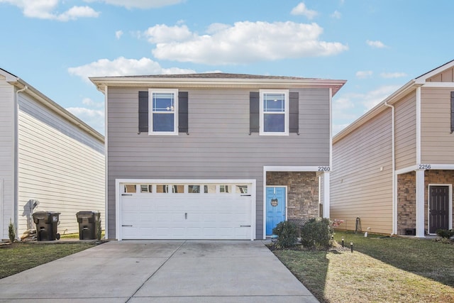 front of property with a garage and a front yard