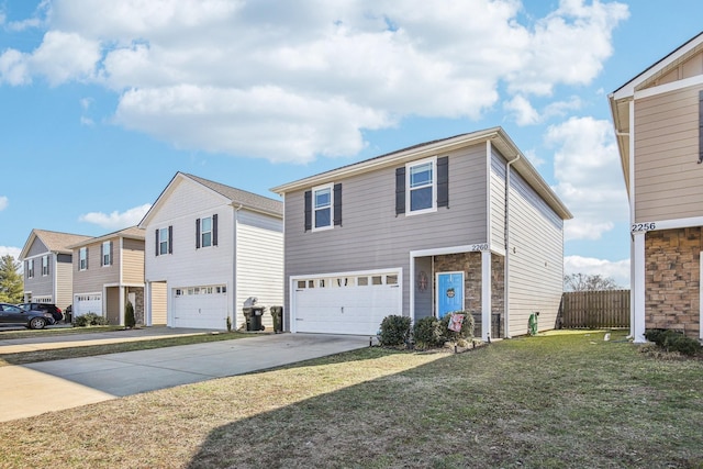 view of front facade with a garage and a front yard