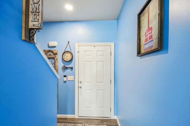 entryway with wood-type flooring