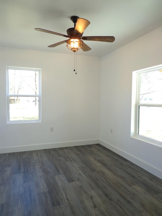 empty room featuring dark hardwood / wood-style floors and ceiling fan