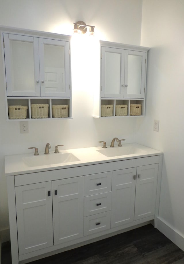 bathroom featuring vanity and wood-type flooring