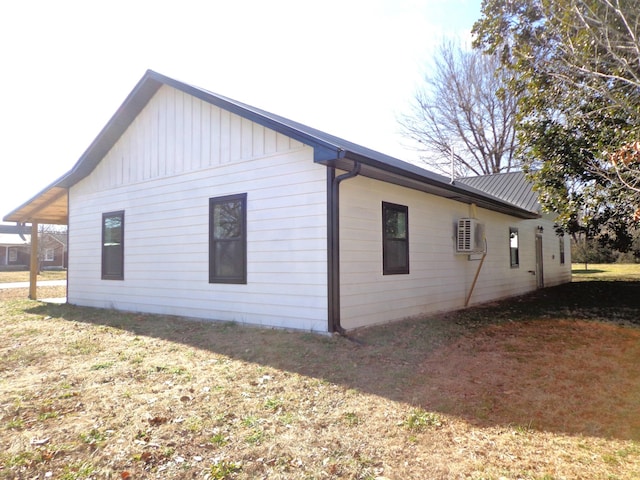 view of side of property with a lawn