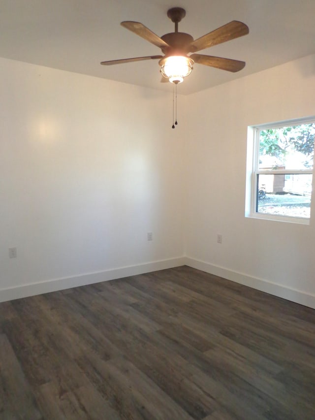 spare room featuring ceiling fan and dark hardwood / wood-style flooring