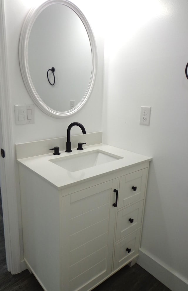 bathroom featuring vanity and wood-type flooring