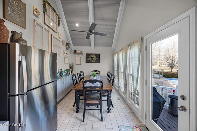 sunroom / solarium featuring ceiling fan and lofted ceiling with beams