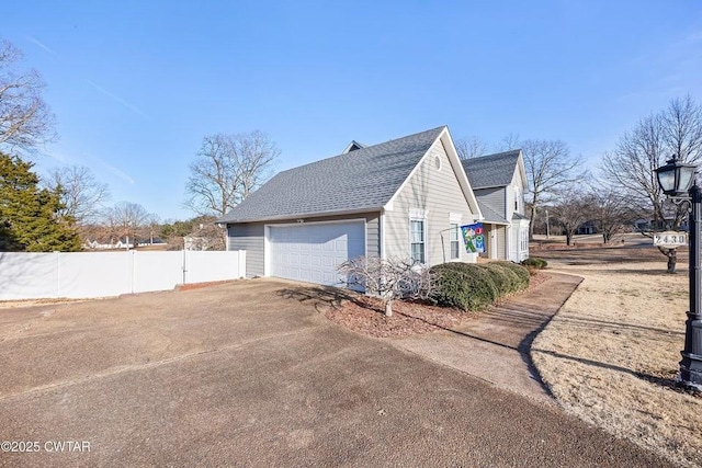 view of side of property featuring a garage