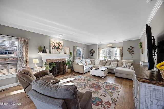 living room with ornamental molding and hardwood / wood-style floors