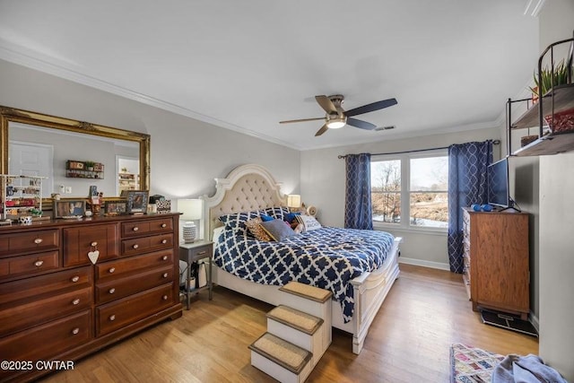 bedroom with crown molding, ceiling fan, and light wood-type flooring