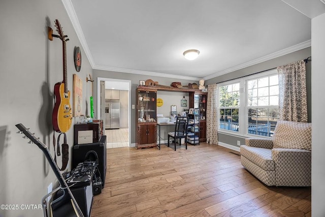 office space featuring ornamental molding and light hardwood / wood-style floors