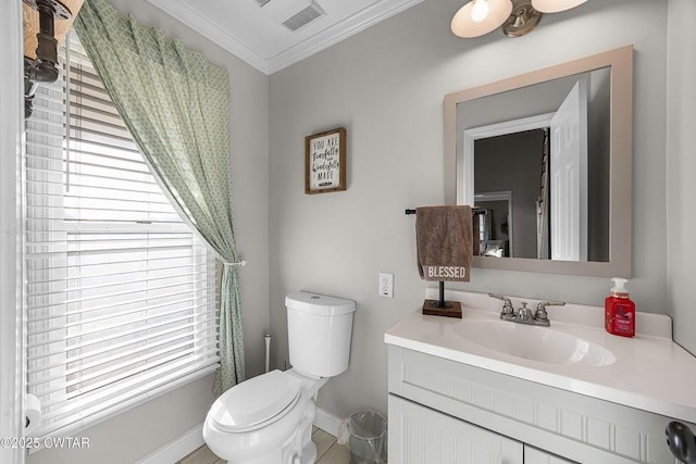 bathroom with vanity, ornamental molding, and toilet