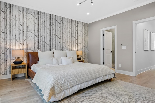 bedroom with crown molding and light wood-type flooring