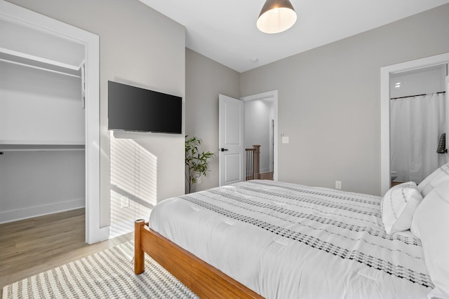 bedroom featuring hardwood / wood-style flooring and a closet