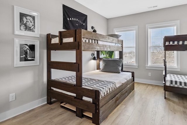 bedroom with light wood-type flooring