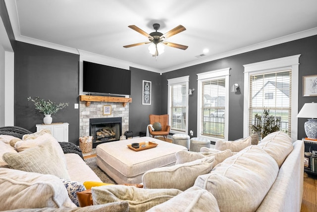 living room featuring crown molding, hardwood / wood-style floors, and ceiling fan