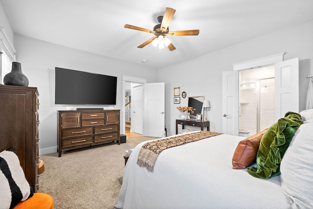 carpeted bedroom featuring ceiling fan and ensuite bathroom