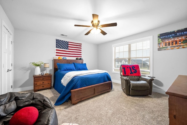 bedroom with ceiling fan and carpet floors