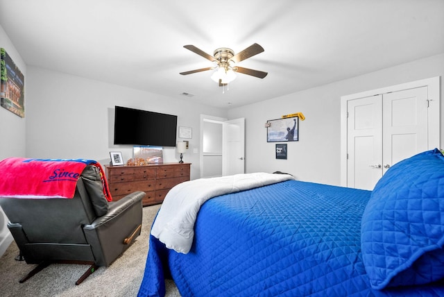 bedroom featuring carpet floors, a closet, and ceiling fan