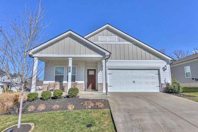 view of front of property featuring a garage and covered porch