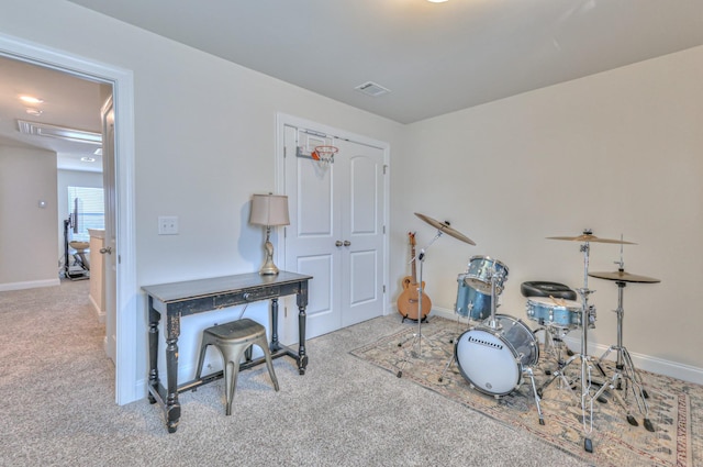 miscellaneous room featuring carpet flooring