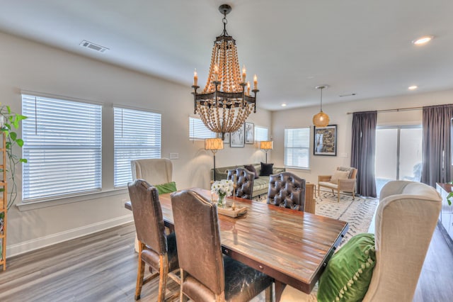 dining room with hardwood / wood-style flooring and plenty of natural light