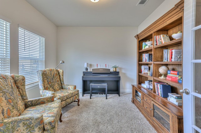 living area featuring carpet