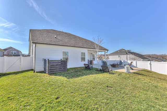 back of property featuring a lawn and a patio