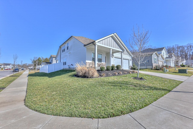 view of front of home with a porch and a front yard