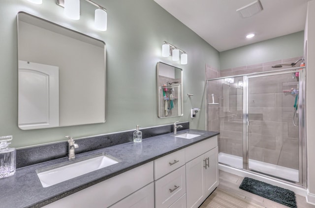 bathroom with vanity and walk in shower