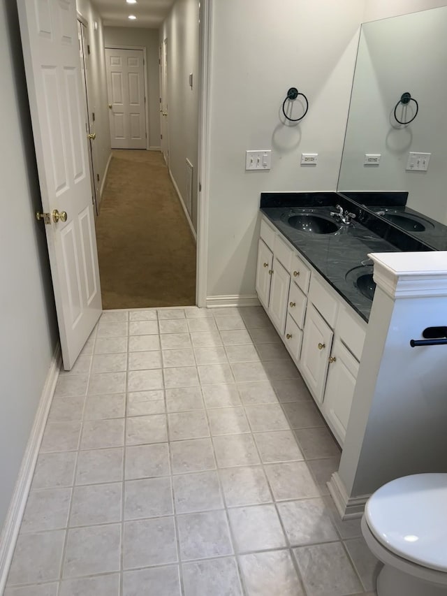 bathroom with tile patterned floors and vanity