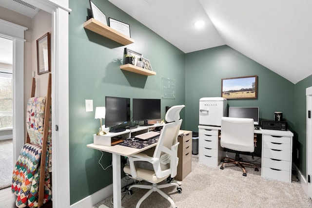 carpeted office featuring lofted ceiling