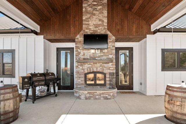 property entrance with a stone fireplace