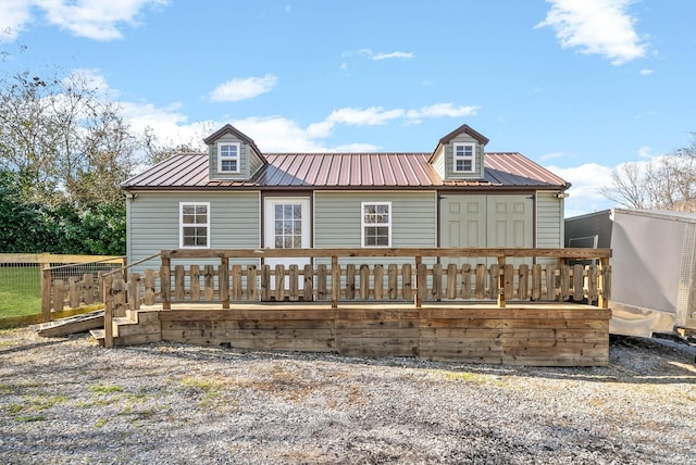 back of property featuring a deck