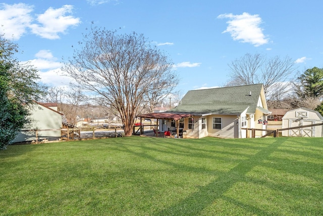 view of yard with a storage shed and a pergola