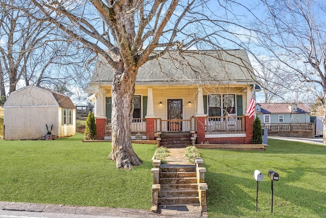 bungalow-style house featuring a front yard and covered porch