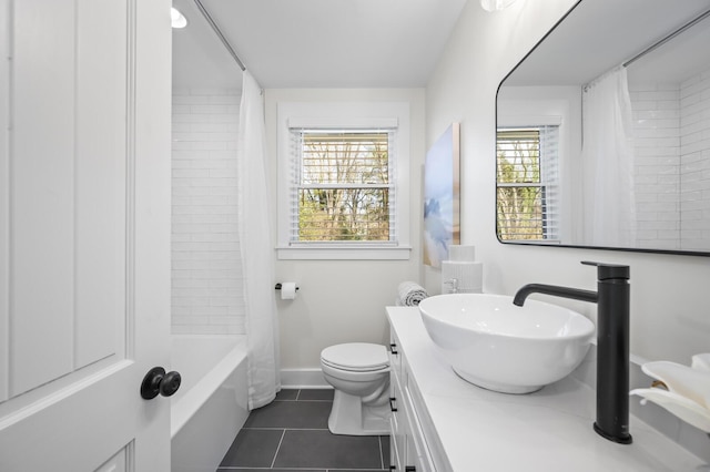 full bathroom featuring tile patterned flooring, vanity, toilet, and shower / tub combo with curtain