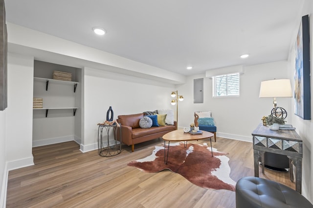 living room featuring hardwood / wood-style flooring and electric panel