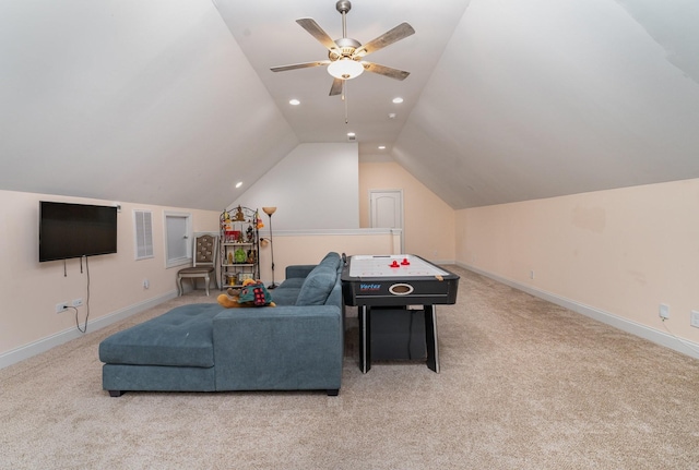 rec room with vaulted ceiling, light colored carpet, and ceiling fan