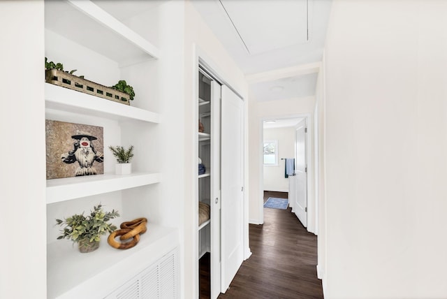 corridor featuring dark hardwood / wood-style floors