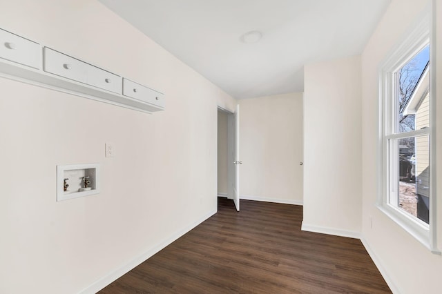 laundry area featuring washer hookup and dark hardwood / wood-style floors