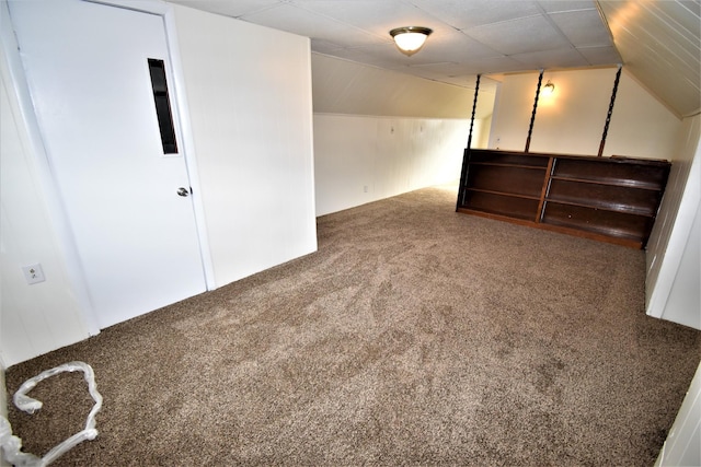 bonus room featuring lofted ceiling and carpet flooring