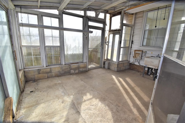 unfurnished sunroom with sink