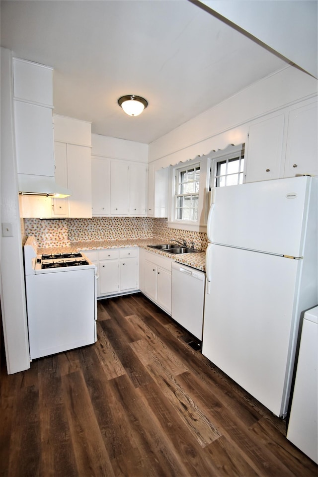 kitchen with white cabinetry, backsplash, white appliances, and dark hardwood / wood-style flooring