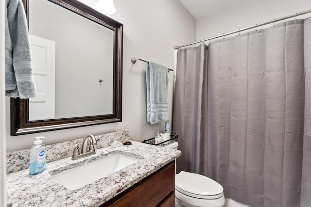 full bathroom featuring vanity, toilet, and shower / tub combo