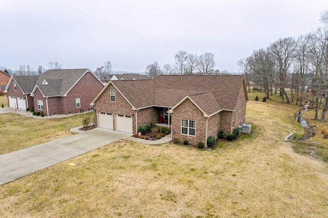 view of front of home featuring a garage and a front yard