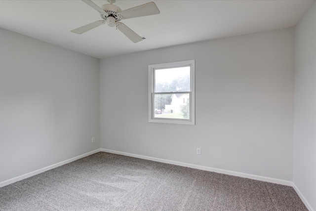 empty room featuring carpet floors and ceiling fan