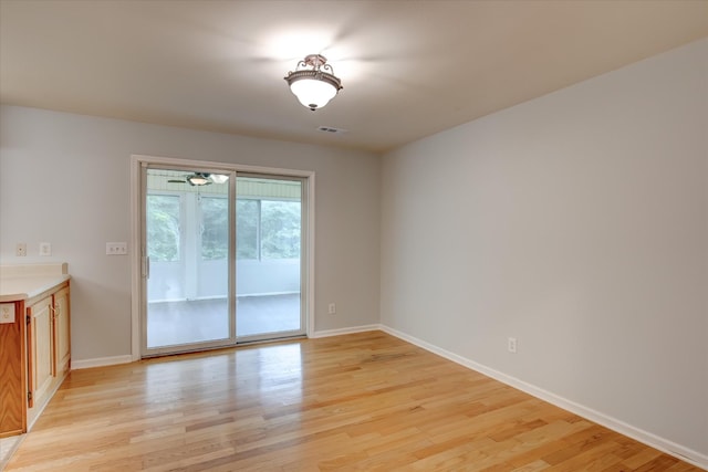 unfurnished room with light hardwood / wood-style floors