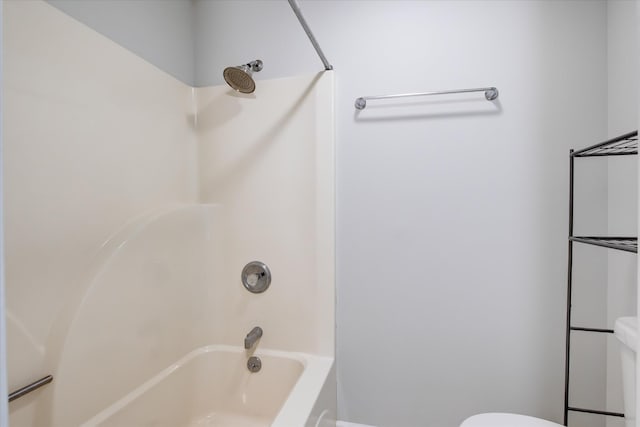 bathroom featuring toilet and shower / bathing tub combination