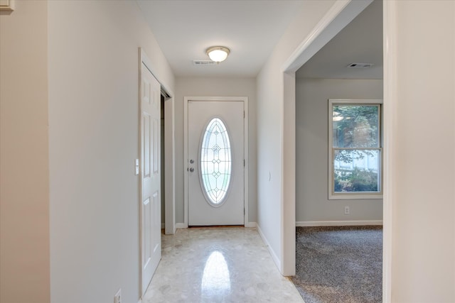 entrance foyer featuring light colored carpet